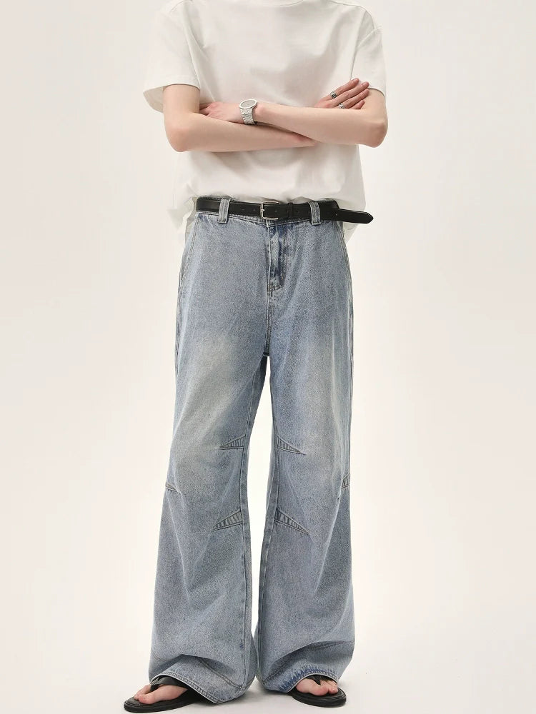 Wide-Leg Faded Distressed Jeans with Unique Seam Detailing