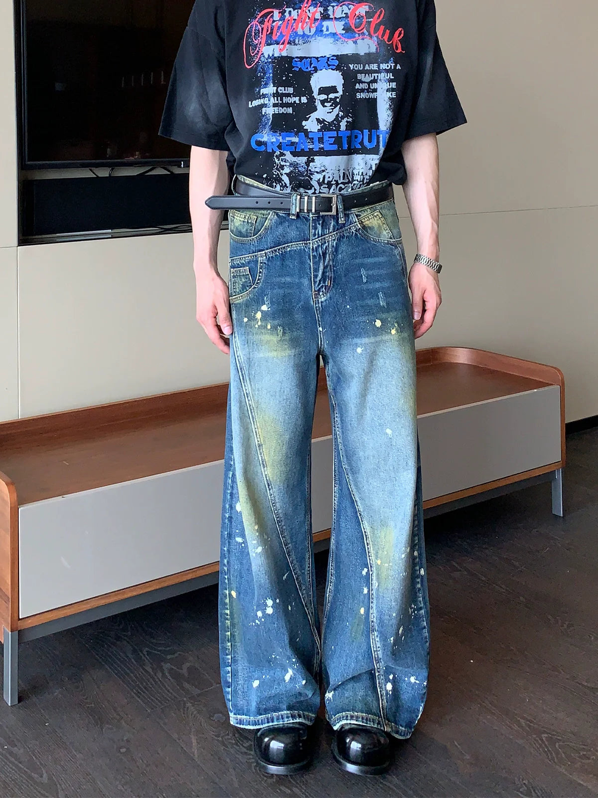 Wide-Leg Blue Jeans with Paint Splatter and Diagonal Seam Details